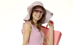 快樂購物的女孩，粉紅色的衣服，帽子，太陽鏡 高清桌布